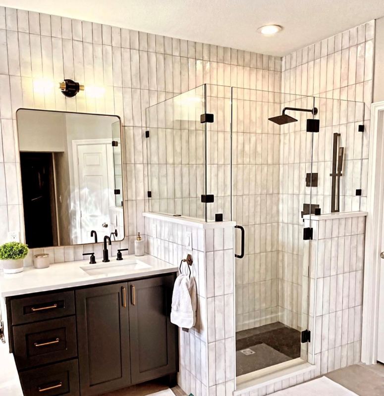 Completed bathroom with a dark timber double vanity
