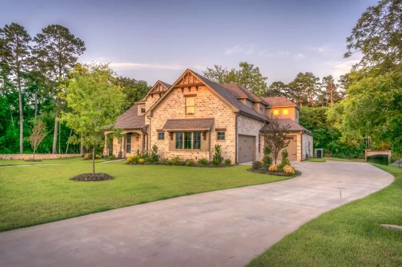 House exterior with hard landscaping and lawn